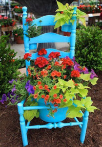 upcycled chair painted with plants in the seat