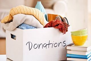 donation box with clothes overflowing
