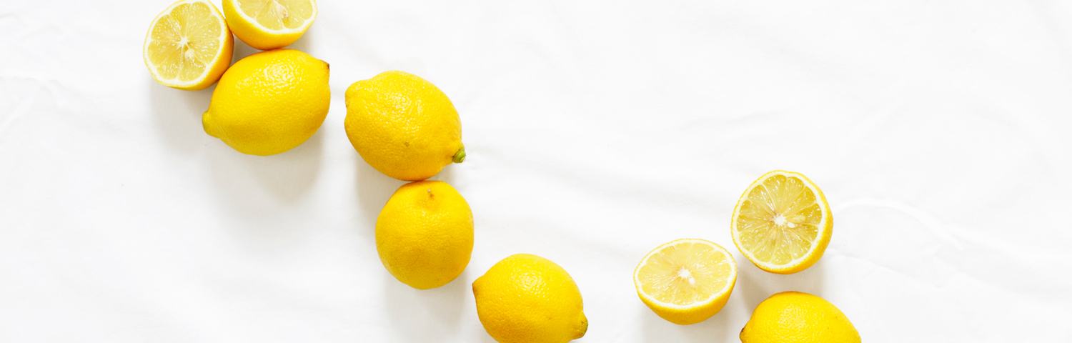 aerial view of lemons on a white countertop