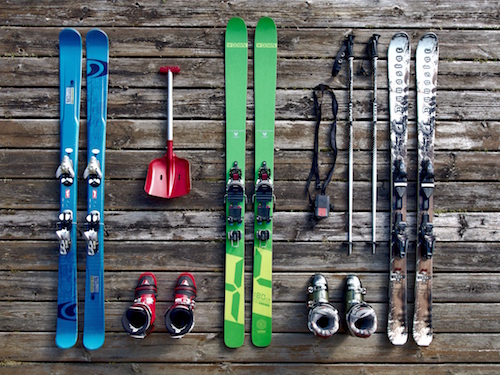 aerial view of skiis lined up on wooden deck