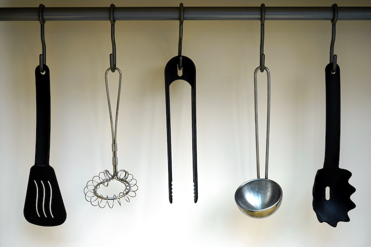 horizontal kitchen utensils hanging on rack
