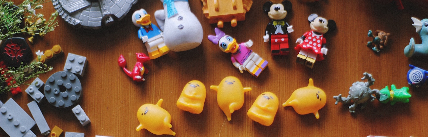various kids toys scattered on the floor aerial view