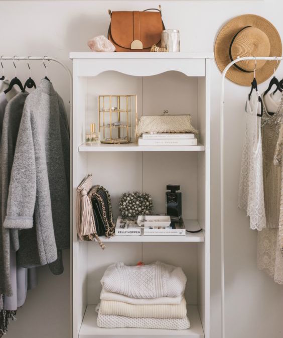 clean white organized closet with hipster clothes